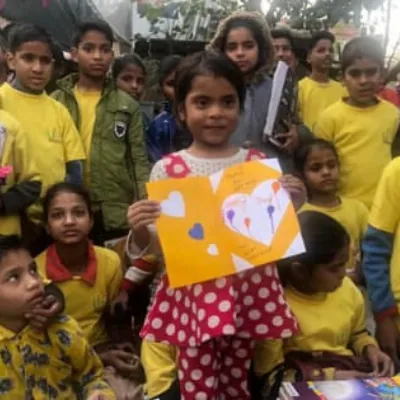 Volunteers supporting students with learning materials